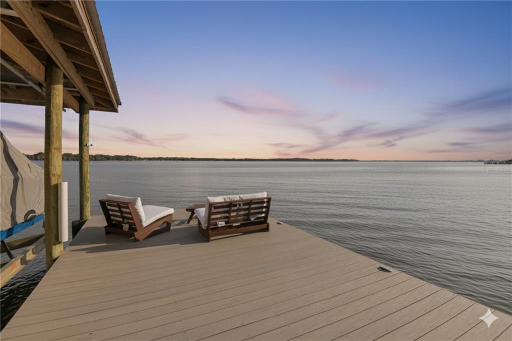 1440 Keystone Ridge Circle Tarpon Springs, FL 34688 - Photo 36 of 45 a view of a terrace with a bench
