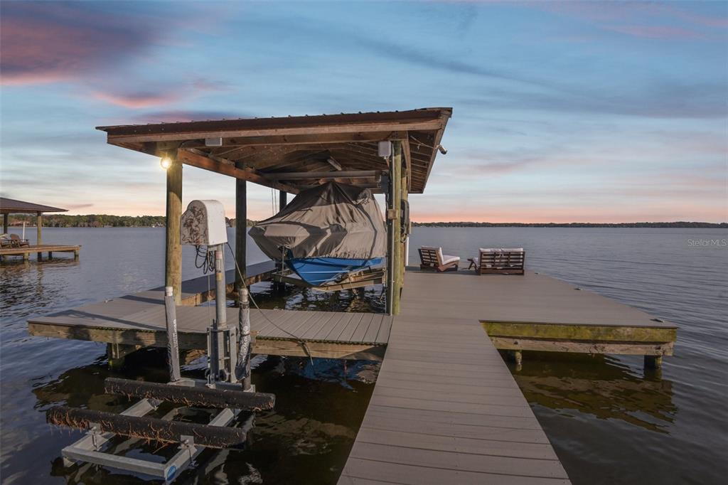 1440 Keystone Ridge Circle Tarpon Springs, FL 34688 - Photo 44 of 45 a view of a balcony with chairs and wooden floor