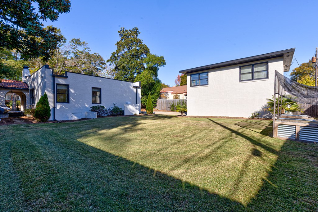 1400 17th Avenue Columbus, GA 31901 - Photo 12 of 50 a backyard of a house with barbeque oven table and chairs