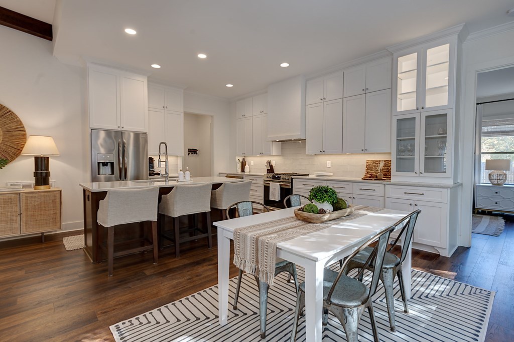 1400 17th Avenue Columbus, GA 31901 - Photo 21 of 50 a kitchen with a dining table chairs and view of living room