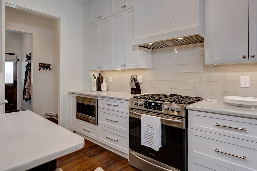 1400 17th Avenue Columbus, GA 31901 - Photo 24 of 50 a kitchen with cabinets and appliances
