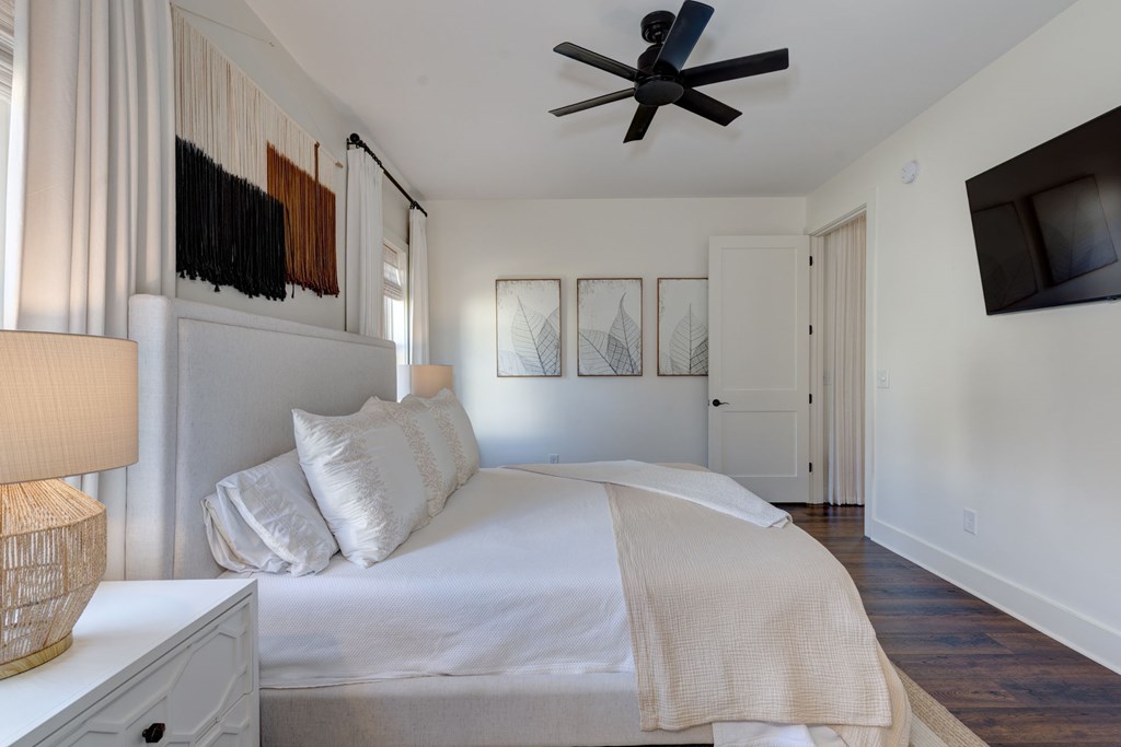 1400 17th Avenue Columbus, GA 31901 - Photo 28 of 50 a bedroom with a bed and a flat screen tv