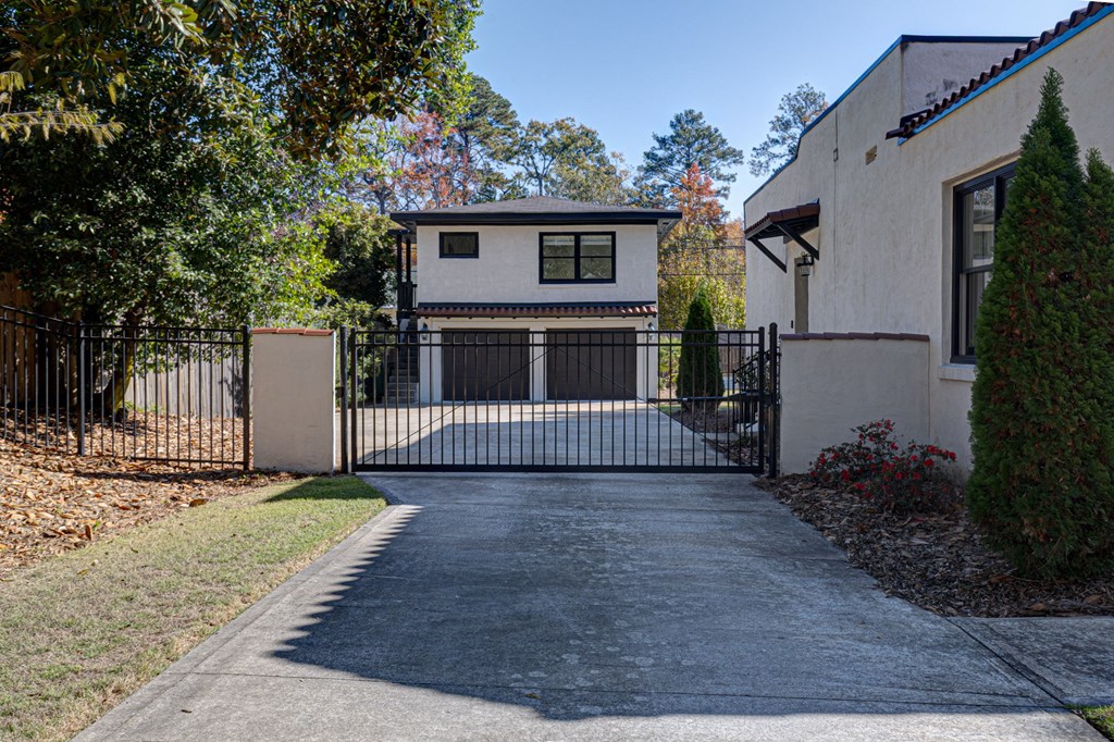1400 17th Avenue Columbus, GA 31901 - Photo 3 of 50 a view of a house with a small yard and wooden fence