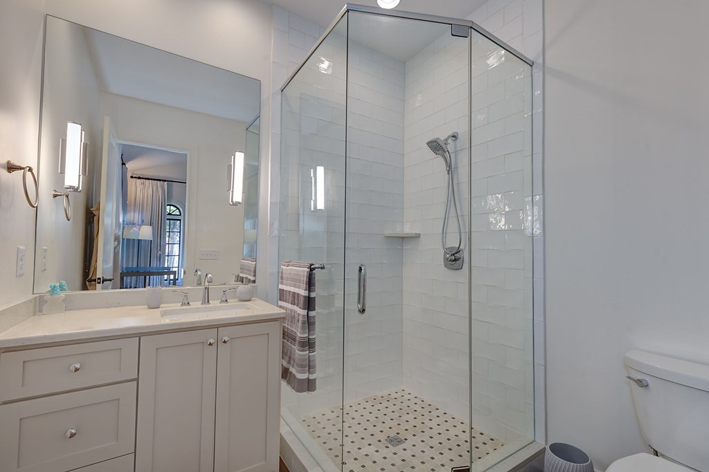 1400 17th Avenue Columbus, GA 31901 - Photo 38 of 50 a bathroom with a shower sink and mirror