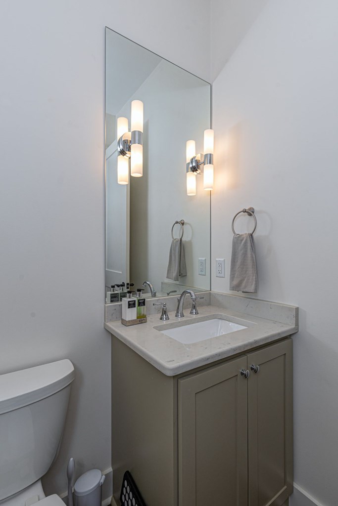 1400 17th Avenue Columbus, GA 31901 - Photo 39 of 50 a bathroom with a toilet sink and mirror