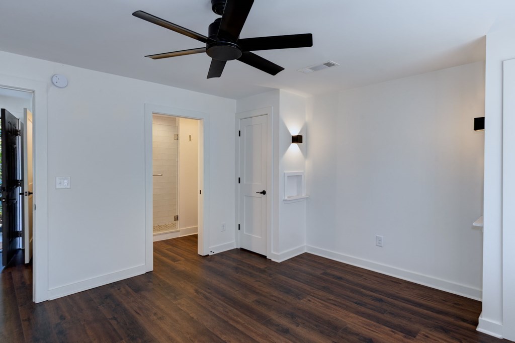 1400 17th Avenue Columbus, GA 31901 - Photo 47 of 50 an empty room with wooden floor a ceiling fan and closet