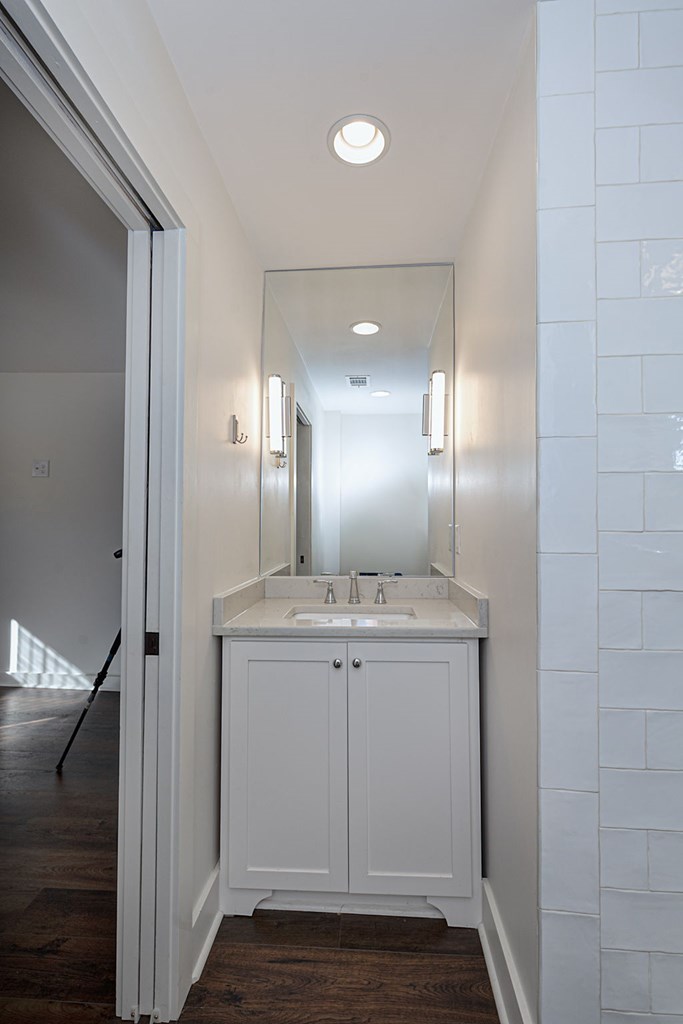 1400 17th Avenue Columbus, GA 31901 - Photo 48 of 50 a view of a bathroom with mirror and sink