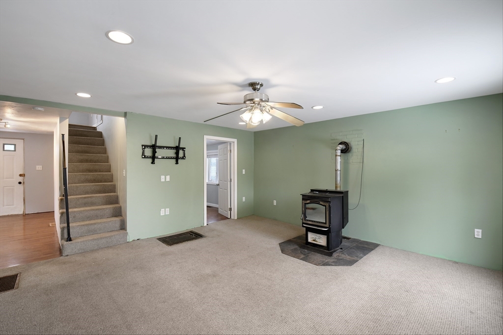 15 Myrtle Avenue Sterling, MA 01564 - Photo 11 of 33 a view of a livingroom with a staircase