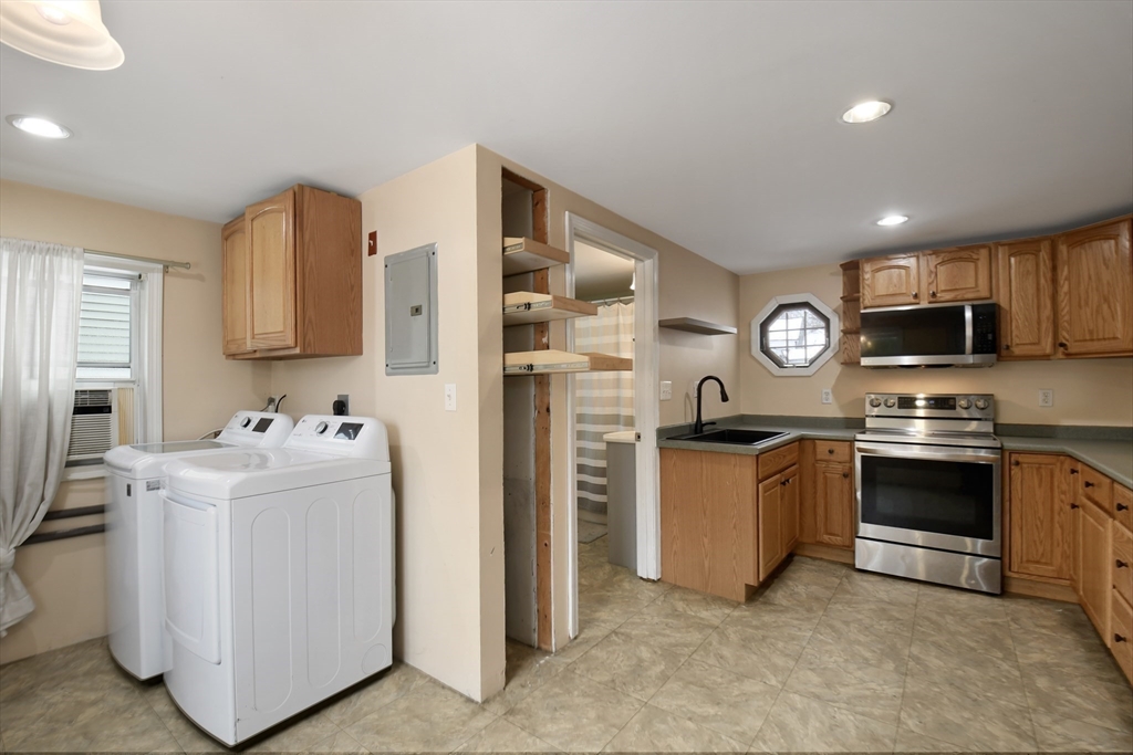 15 Myrtle Avenue Sterling, MA 01564 - Photo 14 of 33 a kitchen with stainless steel appliances granite countertop a stove top oven a sink and dishwasher