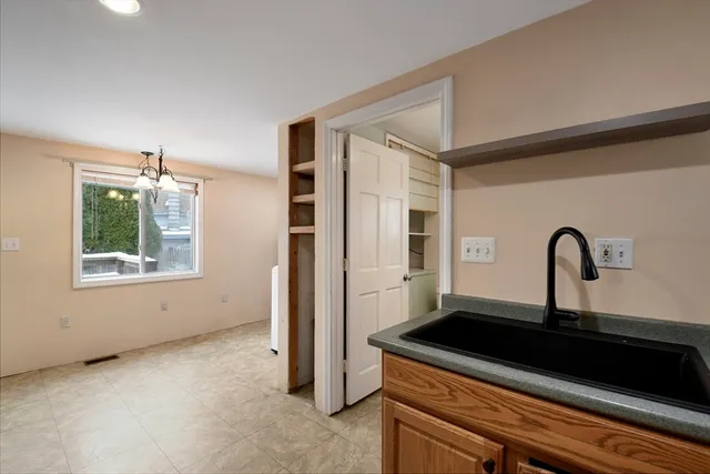 a kitchen with a sink and a refrigerator