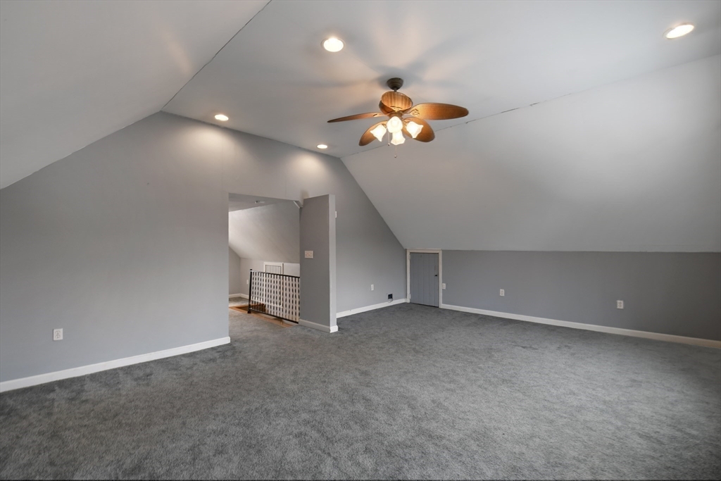 15 Myrtle Avenue Sterling, MA 01564 - Photo 21 of 33 a view of a room with gym equipment and a chandelier