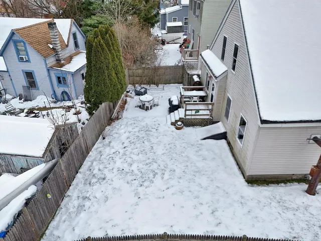 a view of a backyard with sitting area