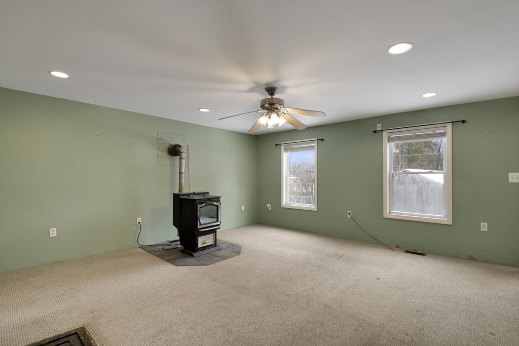 15 Myrtle Avenue Sterling, MA 01564 - Photo 8 of 33 a view of a livingroom with a ceiling fan and window