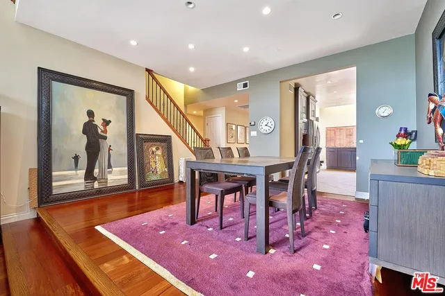 a living room with fireplace furniture and a large window