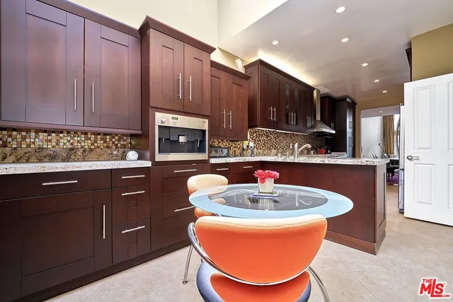 a bathroom with a granite countertop sink mirror and a bathtub