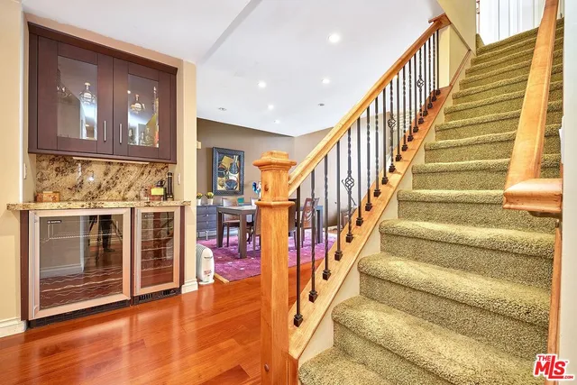 a bed room with a bed and a night stand