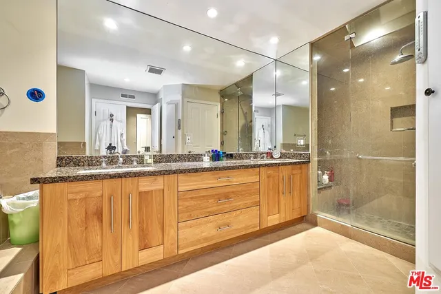 an aerial view of a house with garden space and street view