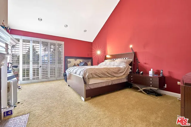 a view of an empty room with a window and balcony