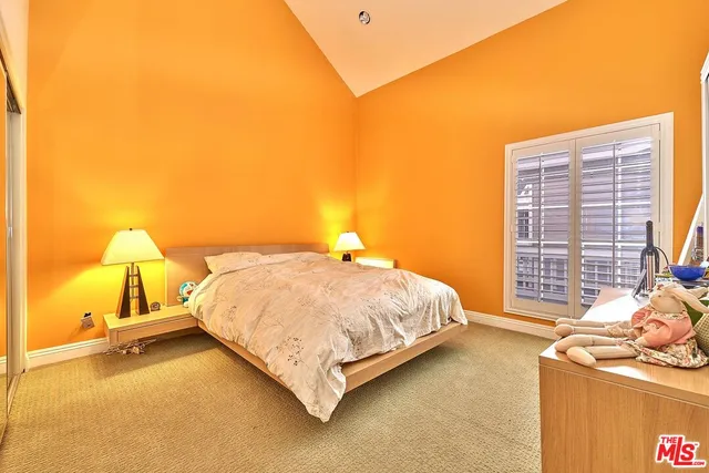 a view of a kitchen with furniture and wooden floor