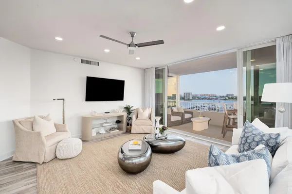 a living room with fireplace furniture and a flat screen tv