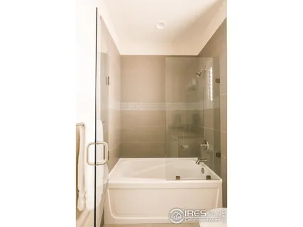 a bathroom with a bathtub and a sink