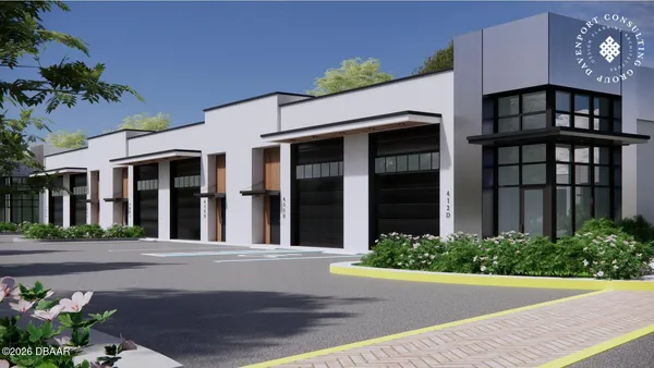 a front view of a building with garden