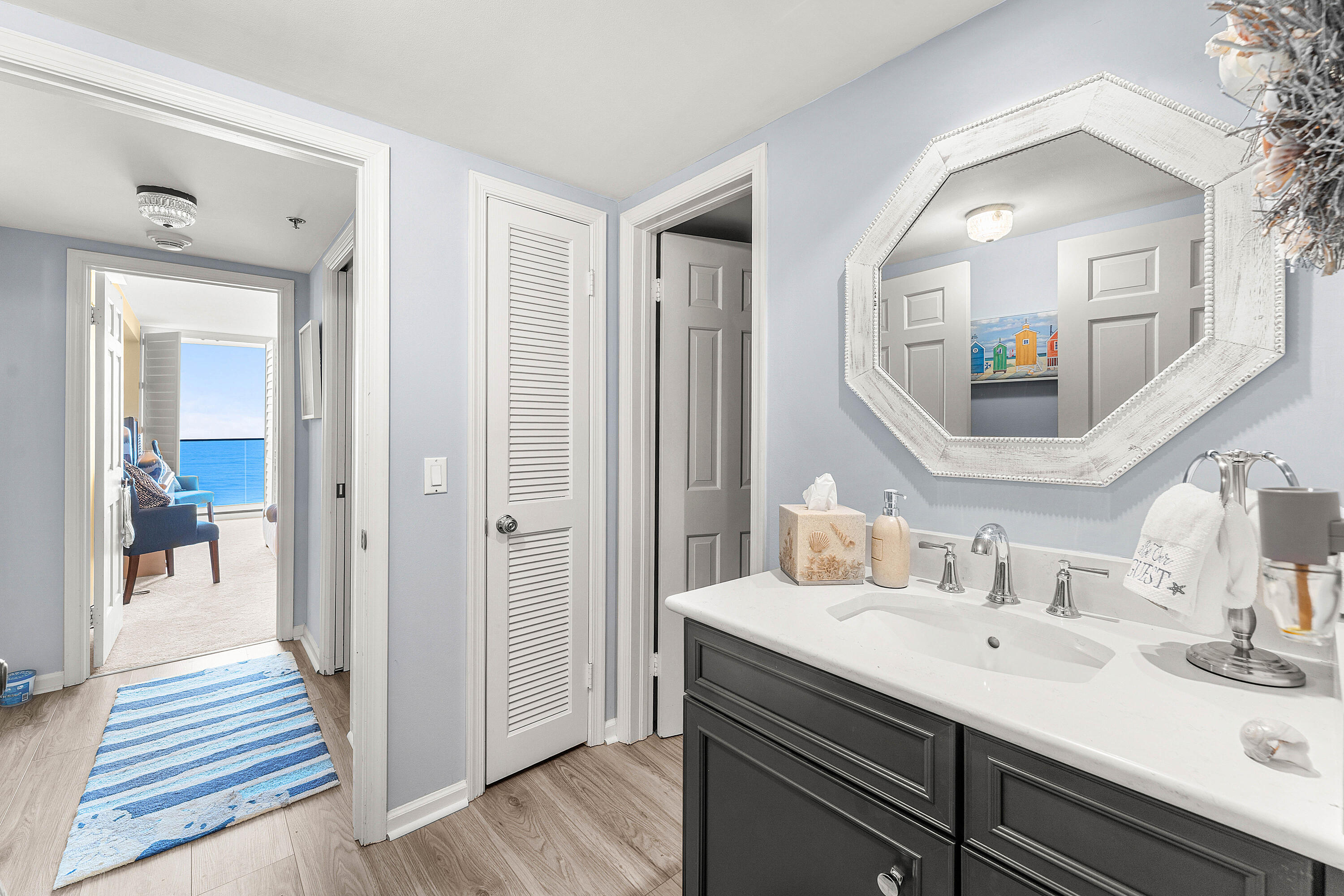 100 South Beach Road, Unit 602 Tequesta, FL 33469 - Photo 19 of 57 a en suite bathroom with a sink and mirror