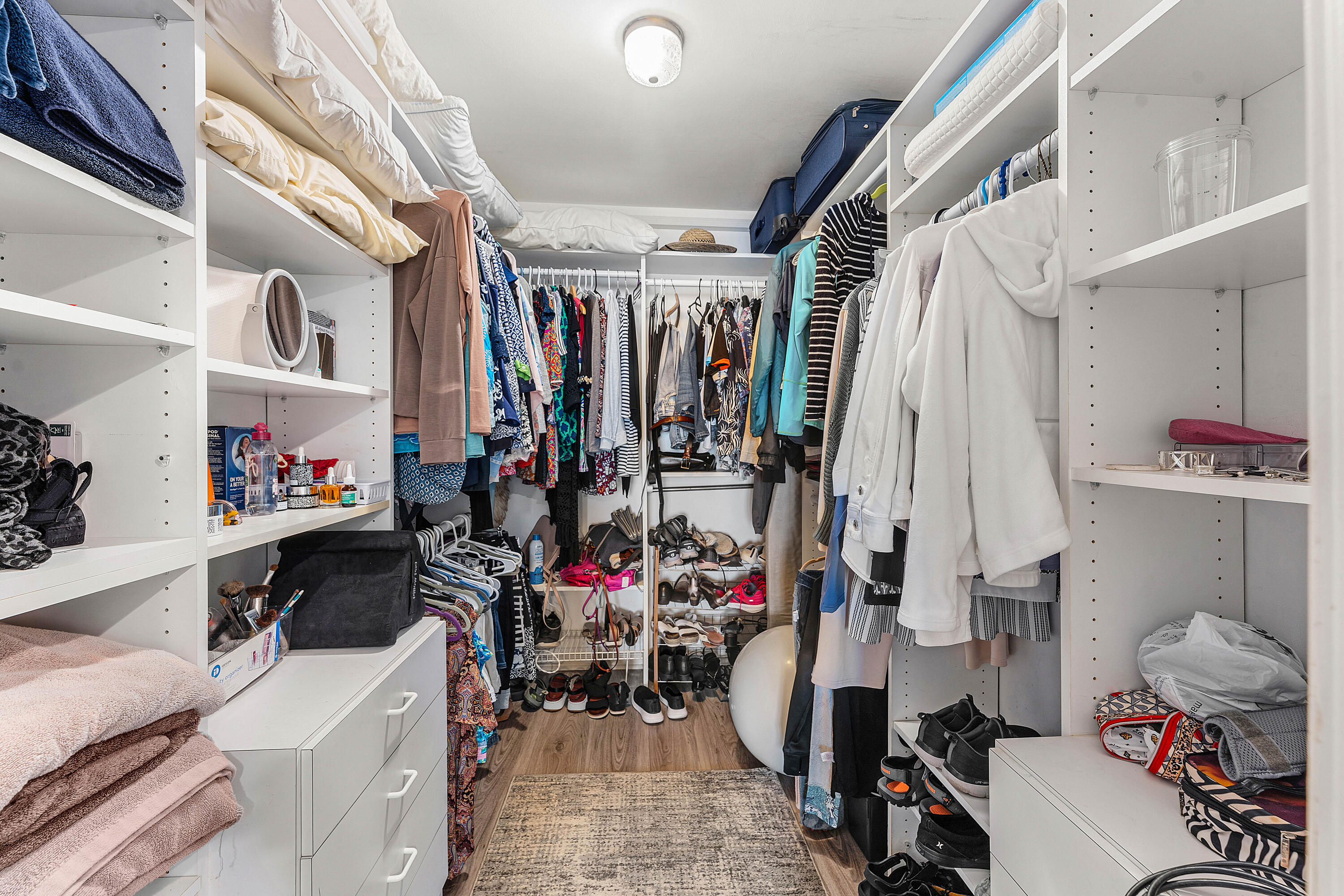100 South Beach Road, Unit 602 Tequesta, FL 33469 - Photo 28 of 57 a view of walk in closet with clothes and shoes