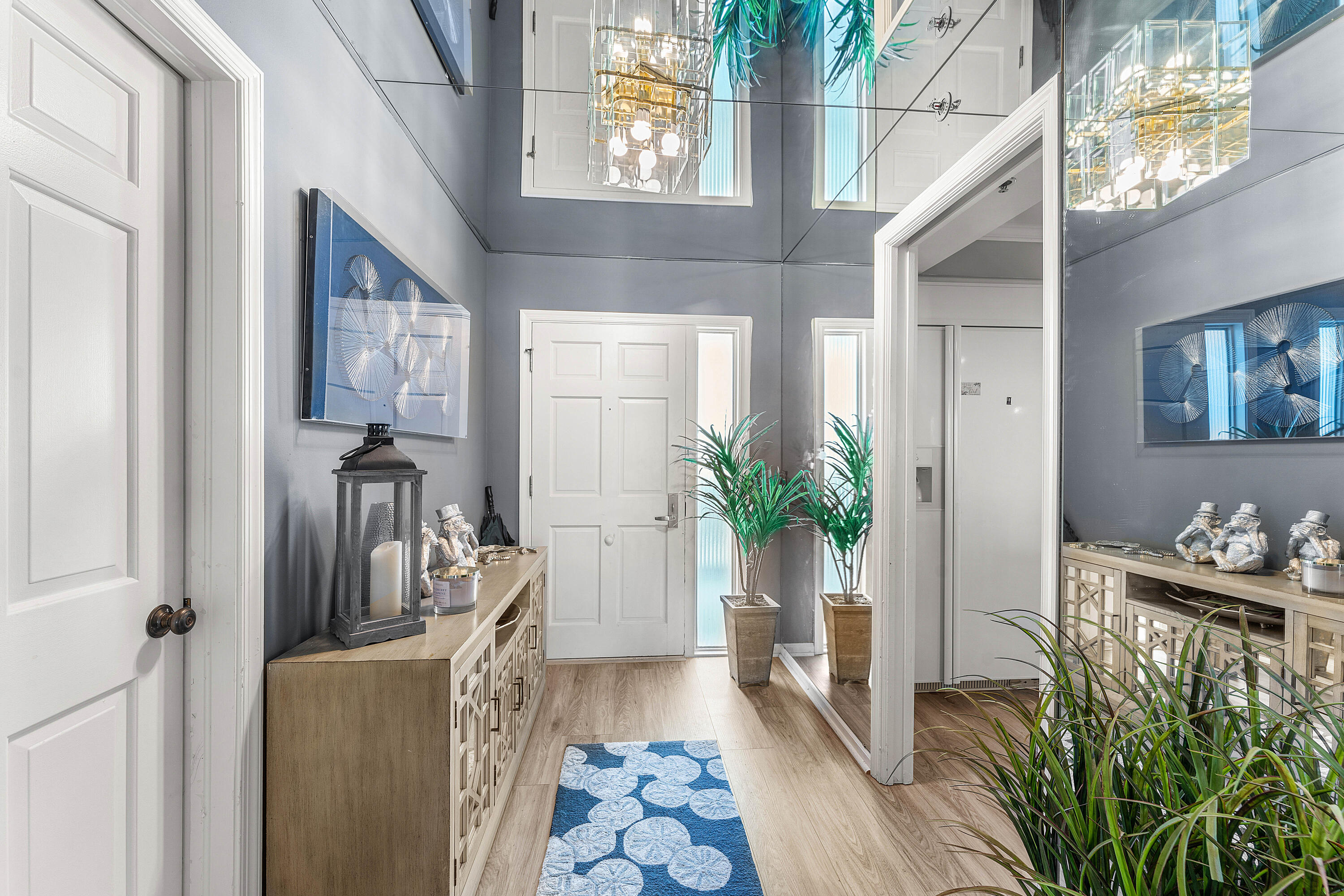 100 South Beach Road, Unit 602 Tequesta, FL 33469 - Photo 4 of 57 a living room with furniture and a potted plant