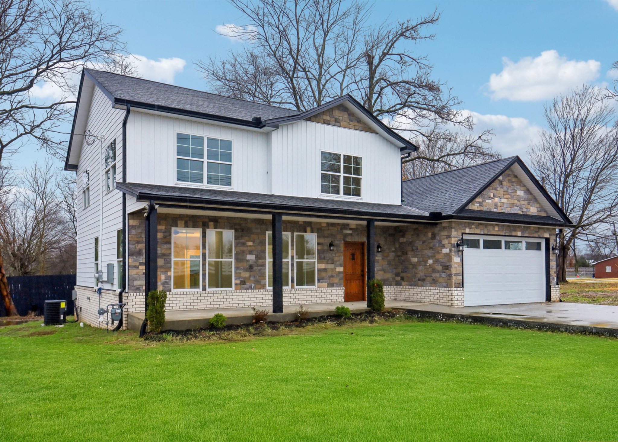 a front view of a house with a garden