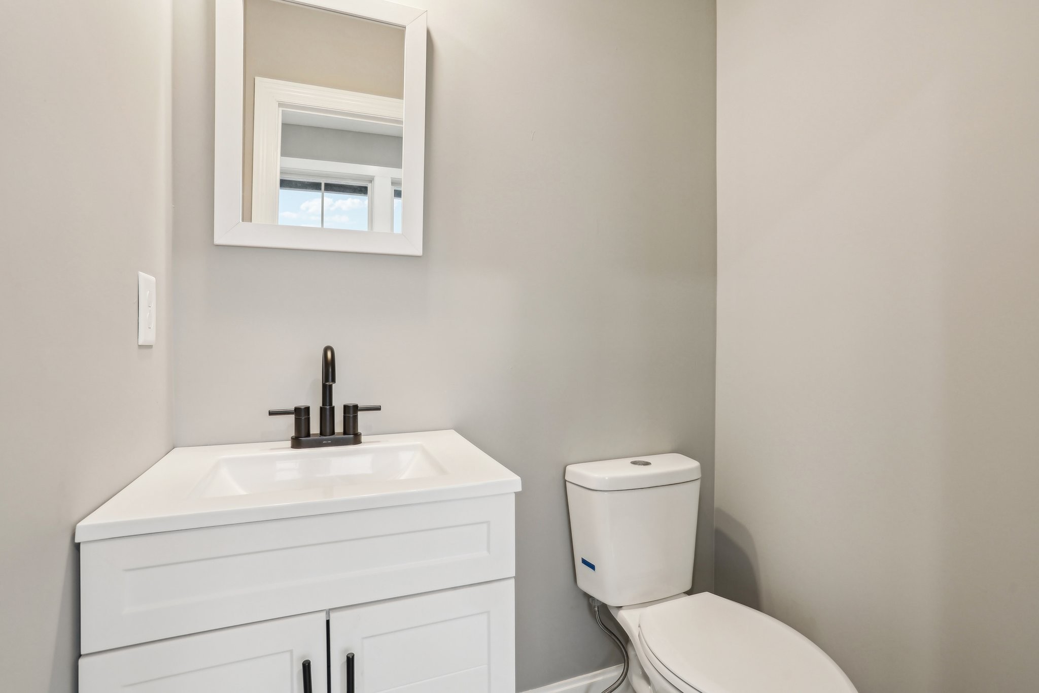 304 Fountainhead Road Portland, TN 37148 - Photo 22 of 38 a bathroom with a toilet sink and mirror