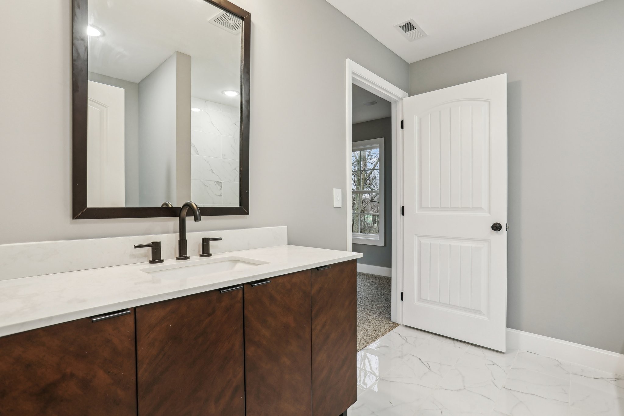304 Fountainhead Road Portland, TN 37148 - Photo 23 of 38 a bathroom with a double vanity sink and mirror