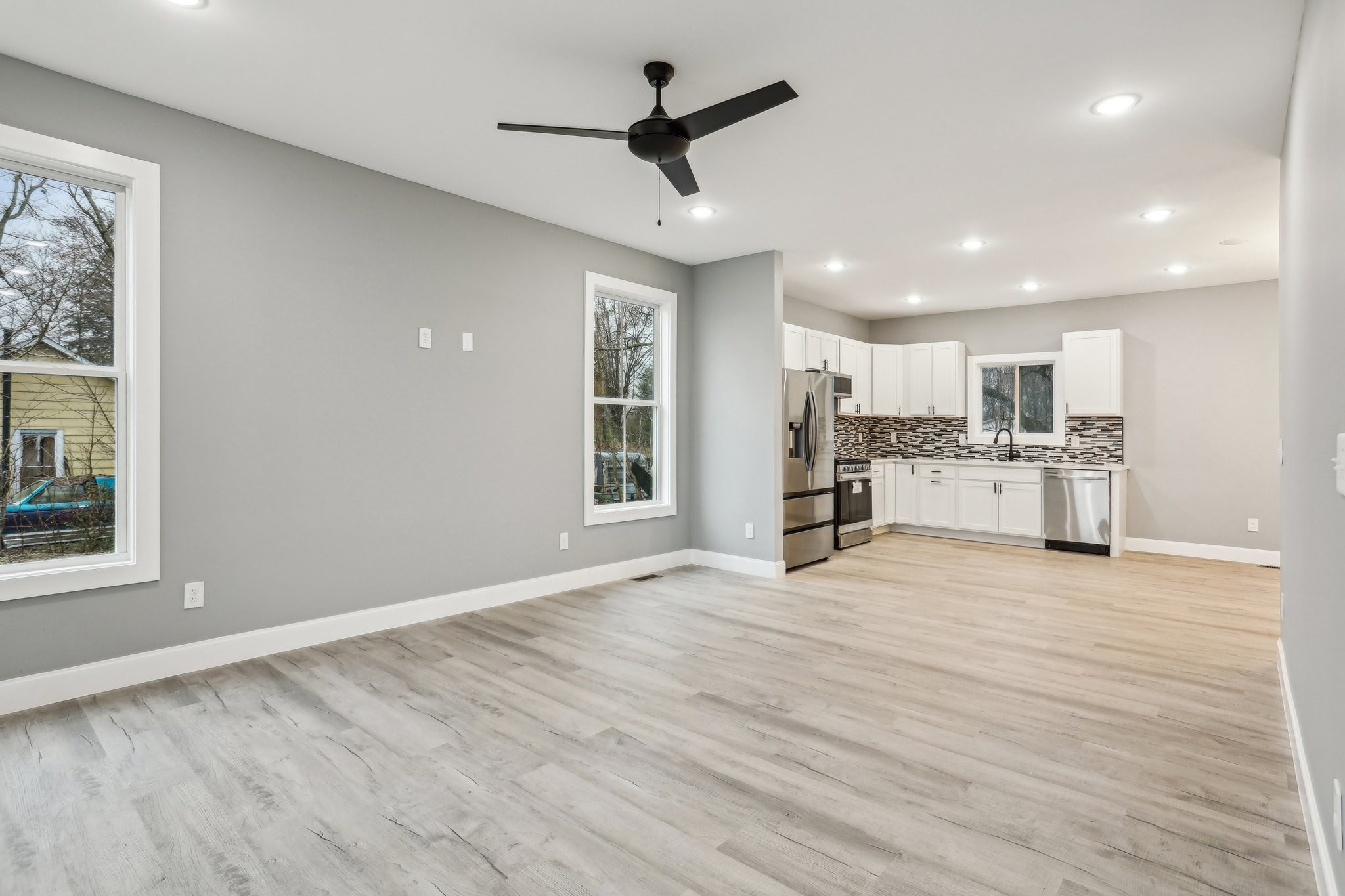 304 Fountainhead Road Portland, TN 37148 - Photo 3 of 38 a view of kitchen with wooden floor and window