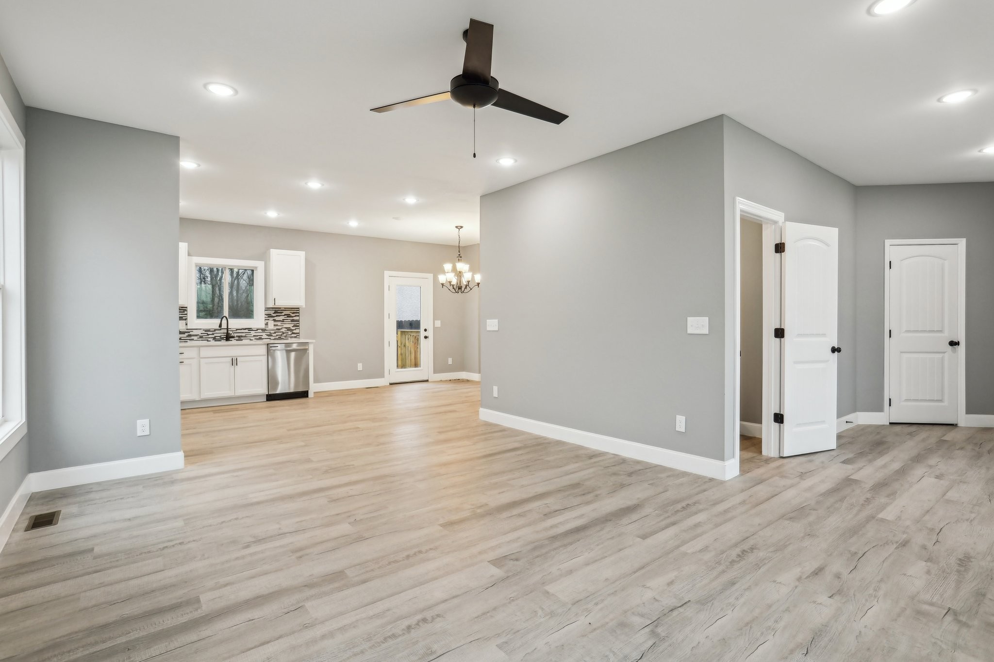 304 Fountainhead Road Portland, TN 37148 - Photo 4 of 38 a view of a kitchen with wooden floor and a kitchen