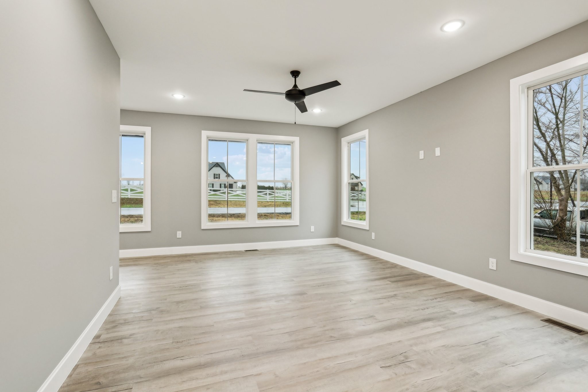 304 Fountainhead Road Portland, TN 37148 - Photo 5 of 38 wooden floor in an empty room with a window