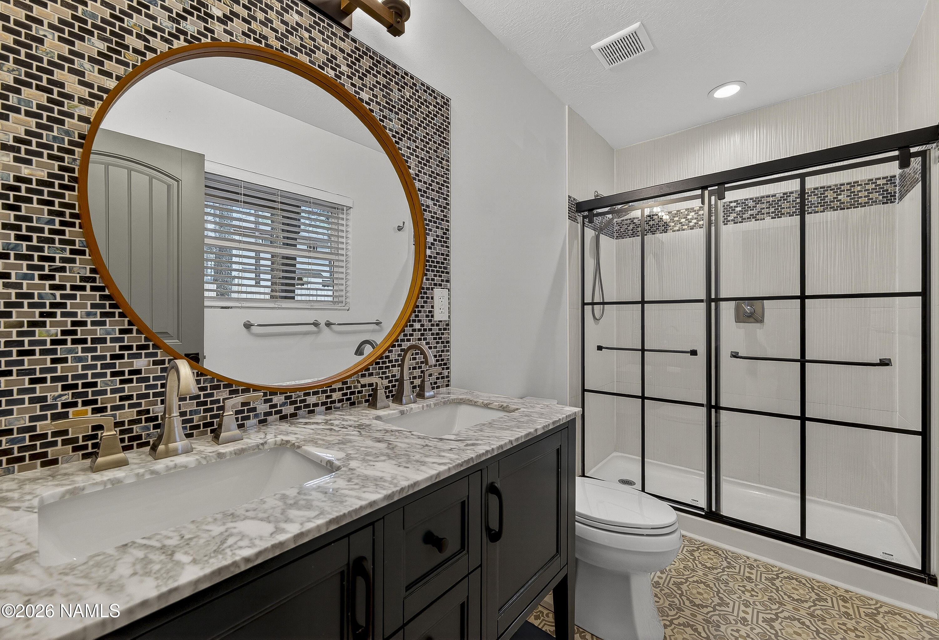 530 East Charles Road Flagstaff, AZ 86001 - Photo 25 of 54 a bathroom with a granite countertop sink mirror vanity and toilet