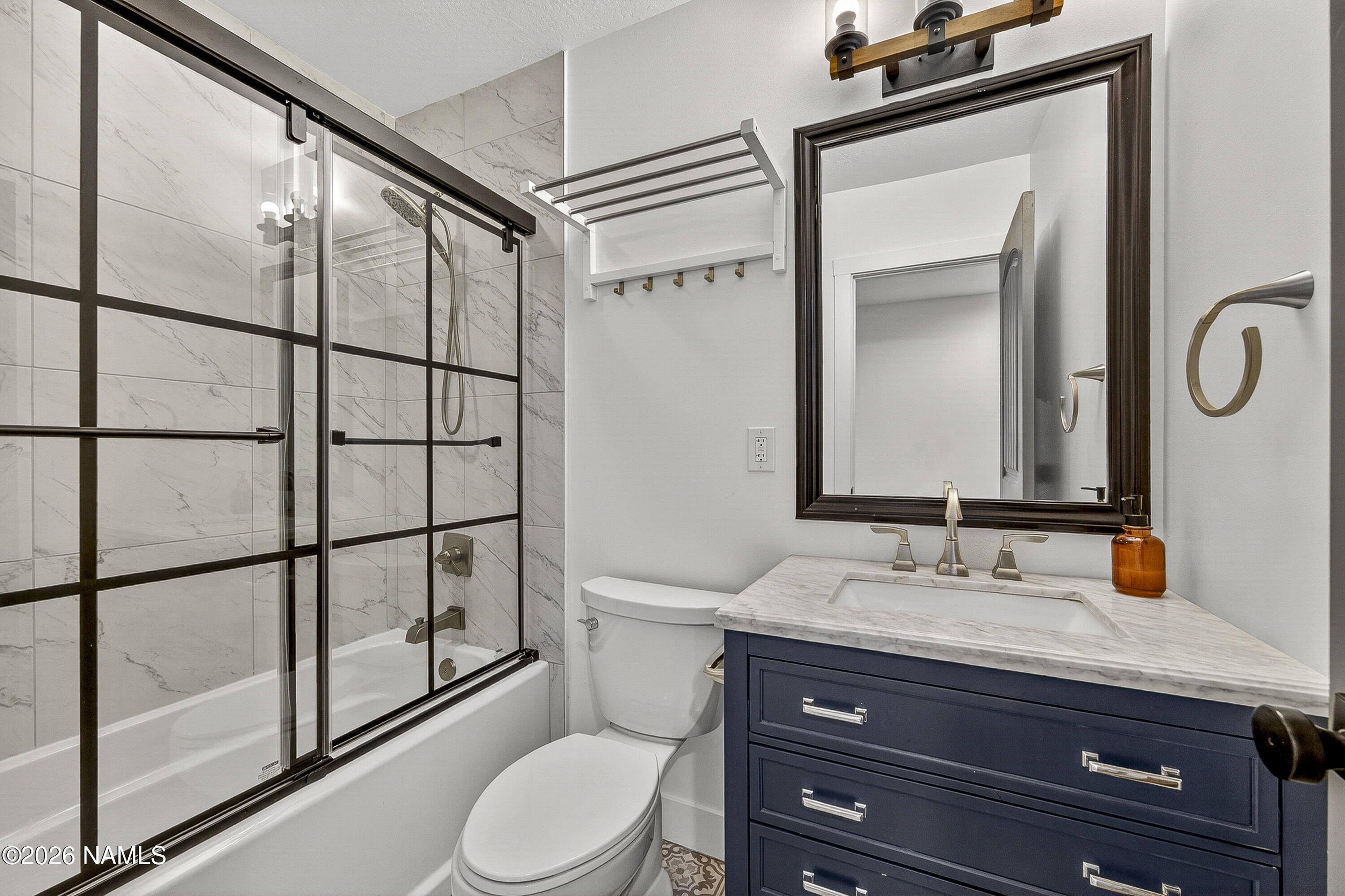 530 East Charles Road Flagstaff, AZ 86001 - Photo 26 of 54 a bathroom with a toilet a sink and a mirror