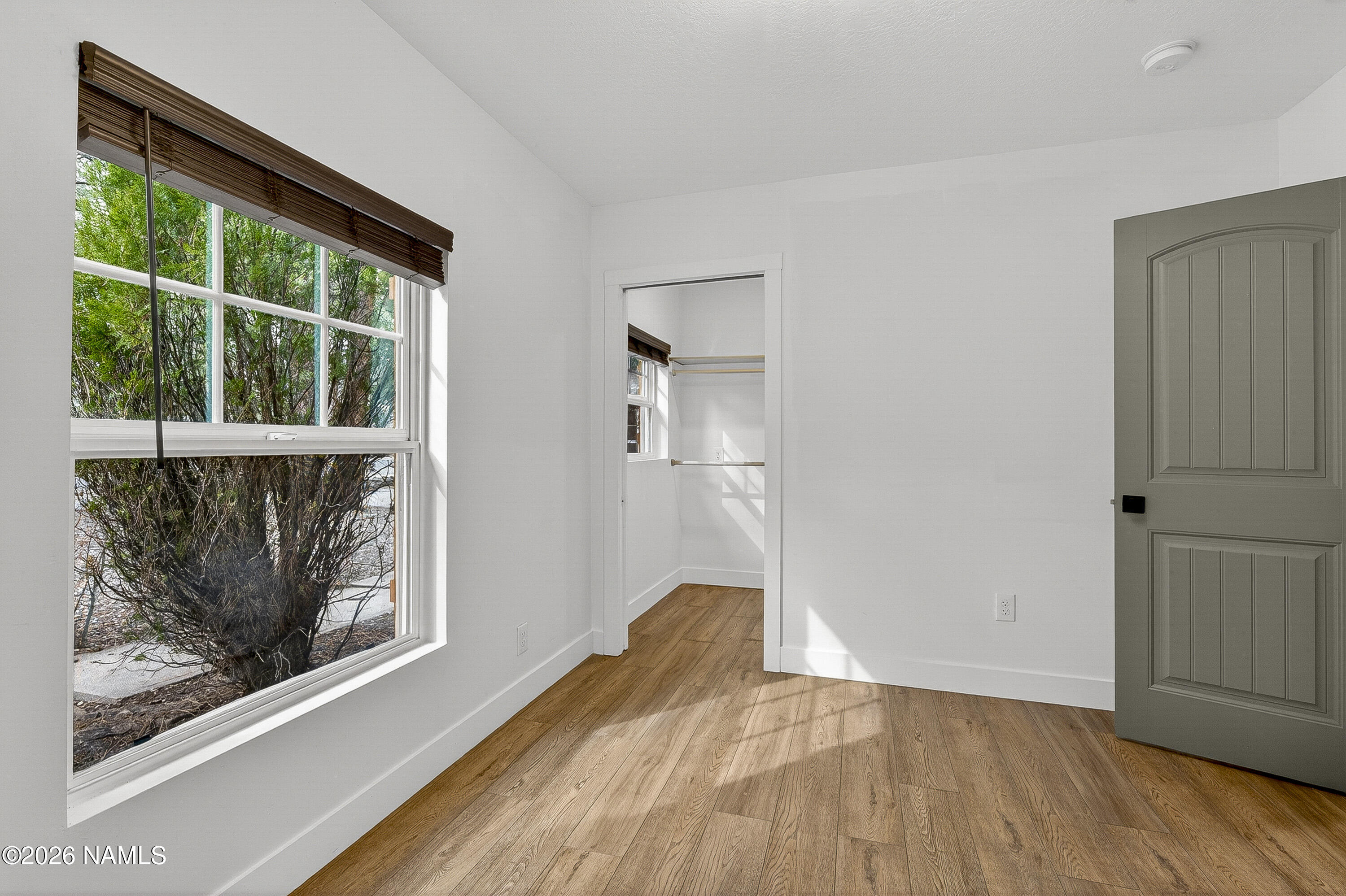 530 East Charles Road Flagstaff, AZ 86001 - Photo 27 of 54 a view of empty room with wooden floor and fan