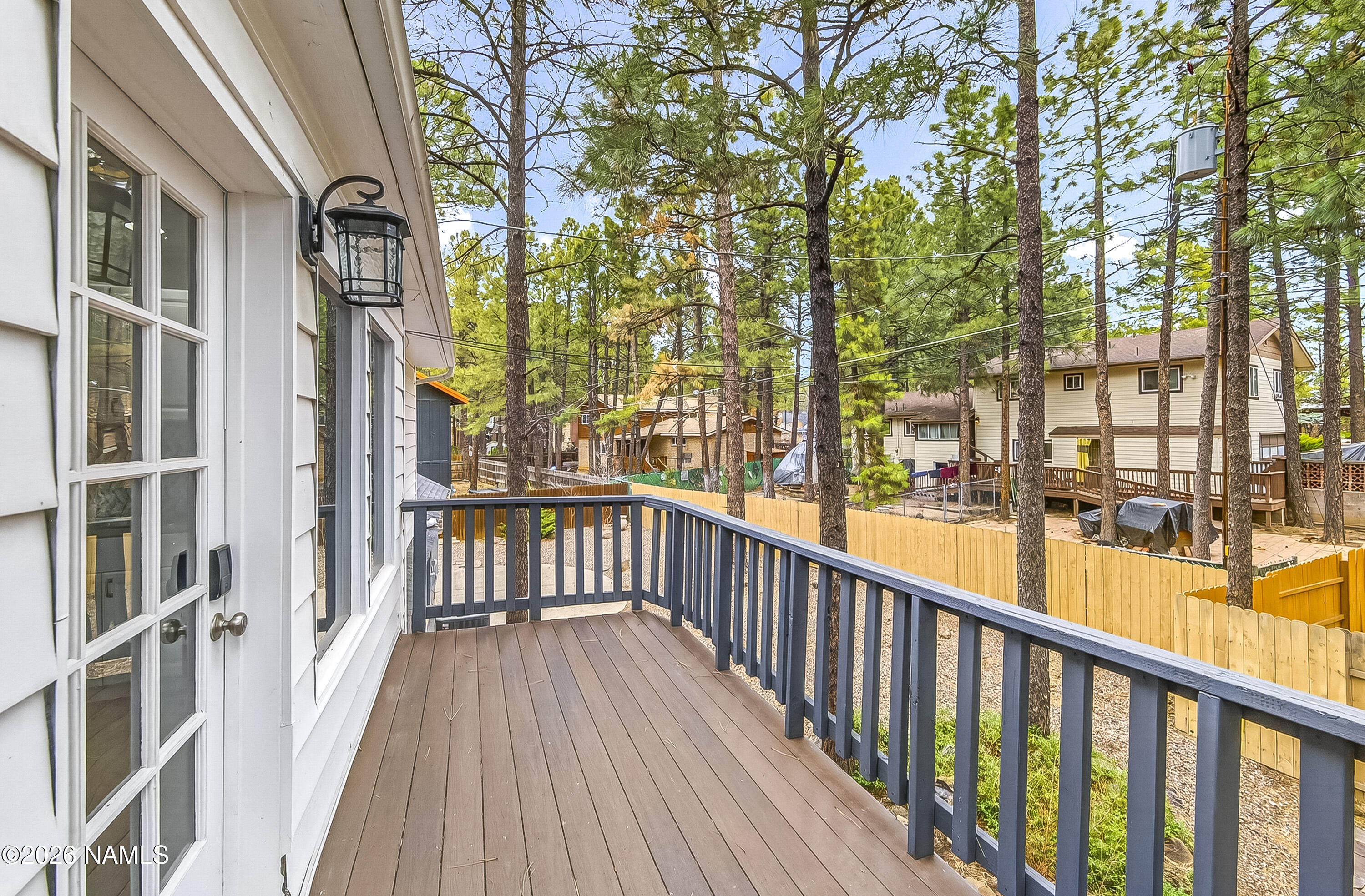 530 East Charles Road Flagstaff, AZ 86001 - Photo 42 of 54 a view of a balcony with wooden floor and fence
