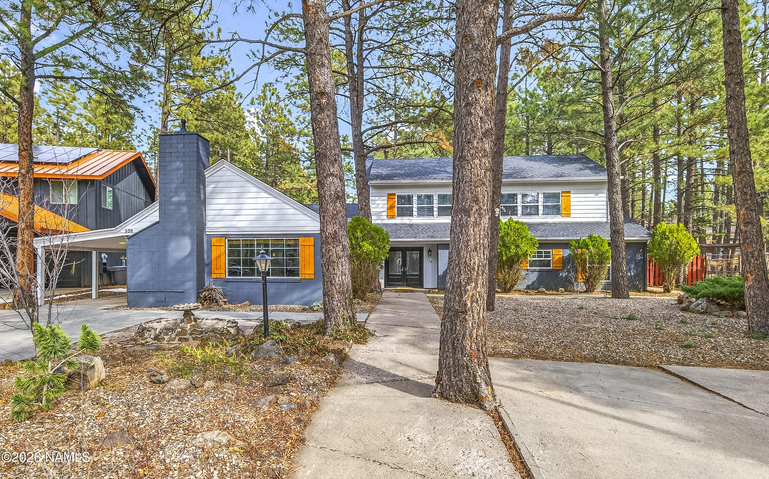 530 East Charles Road Flagstaff, AZ 86001 - Photo 53 of 54 front view of a house with a tree in front of it