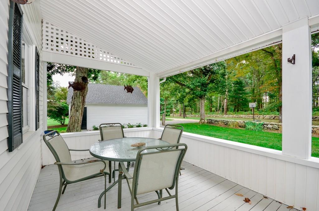 125 Converse Road Marion, MA 02738 - Photo 4 of 40 a view of a patio with a table chairs and a backyard