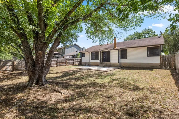 a view of a backyard with trees