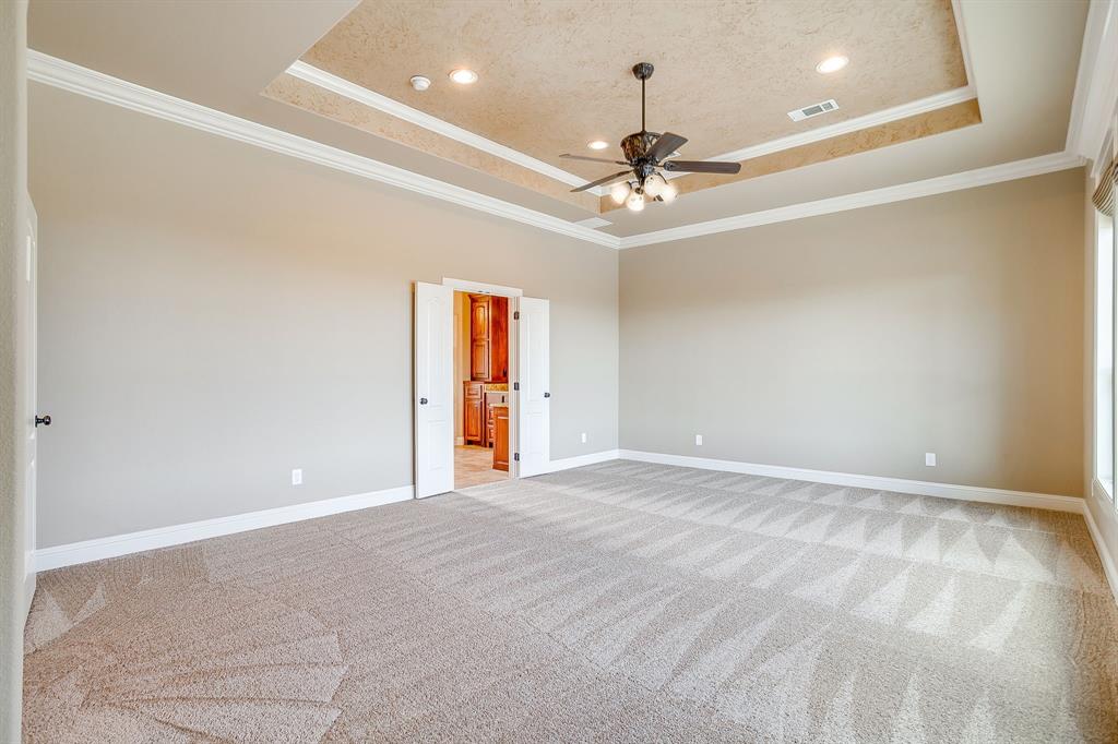 1600 Oak Ridge Estates Weatherford, TX 76085 - Photo 20 of 40 a view of an empty room with a chandelier fan