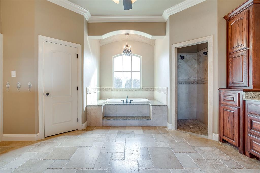 1600 Oak Ridge Estates Weatherford, TX 76085 - Photo 23 of 40 a bathroom with a tub shower and sink