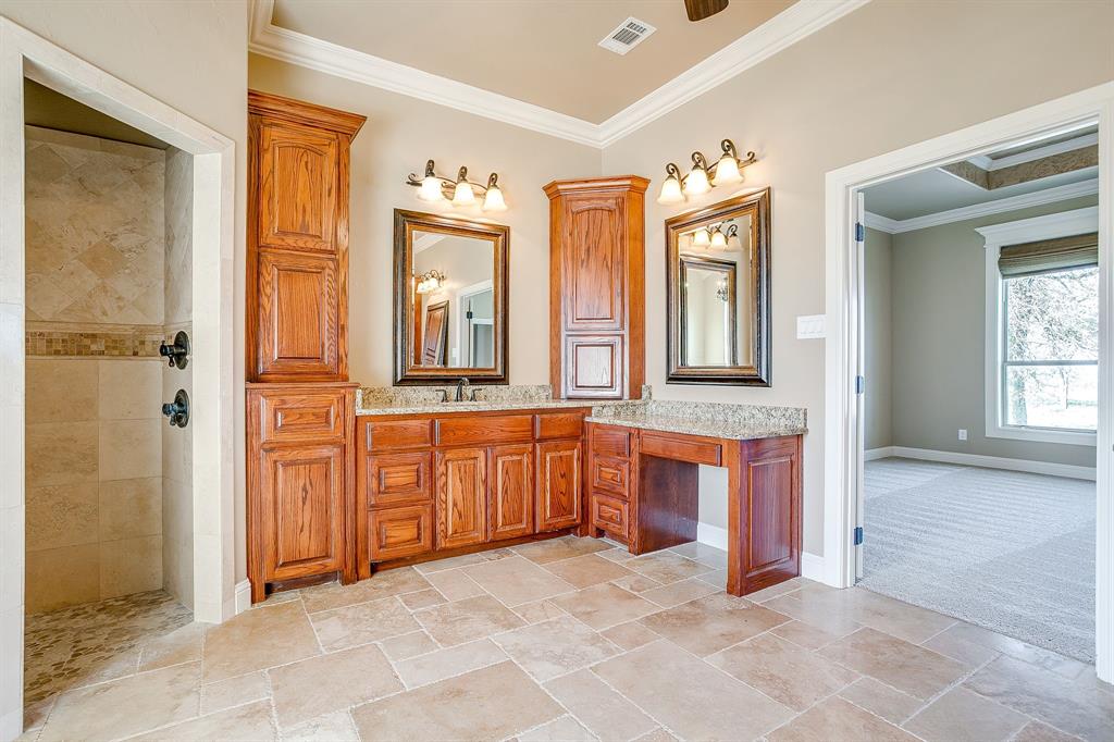 1600 Oak Ridge Estates Weatherford, TX 76085 - Photo 24 of 40 an empty room with large mirror and door