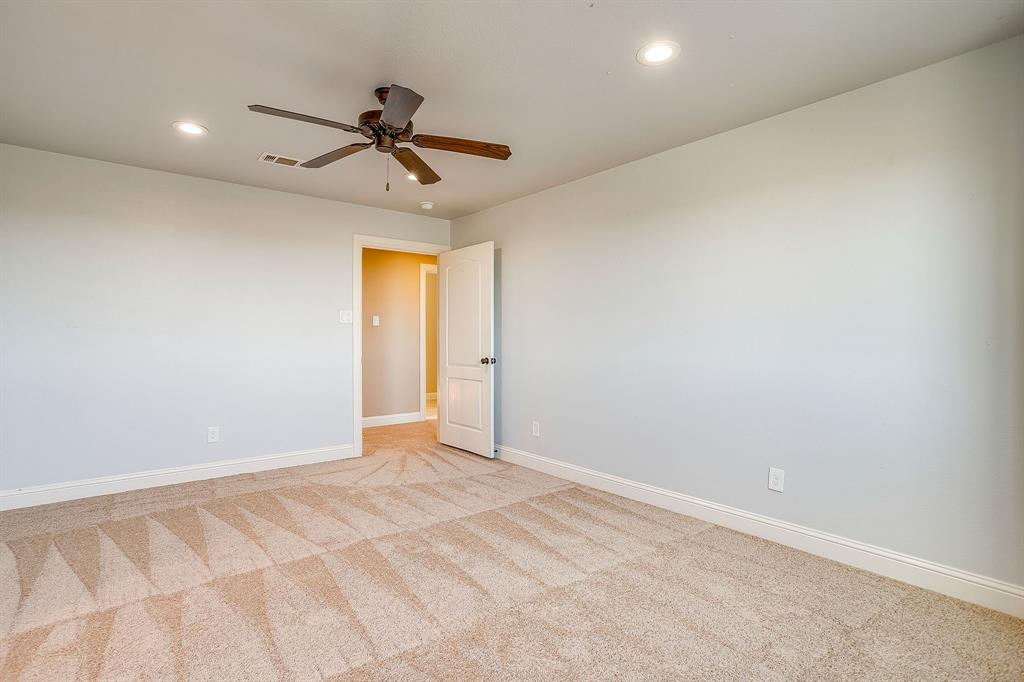 1600 Oak Ridge Estates Weatherford, TX 76085 - Photo 31 of 40 a view of a room with a ceiling fan and window