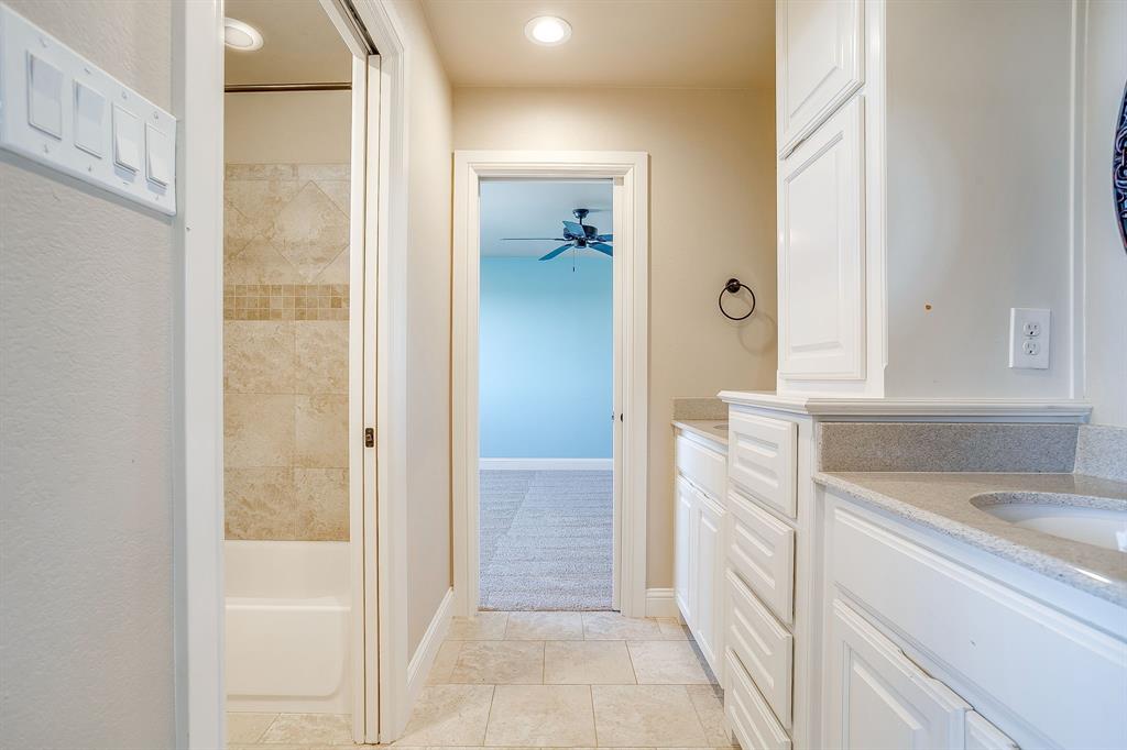 1600 Oak Ridge Estates Weatherford, TX 76085 - Photo 33 of 40 a bathroom with a sink and a shower