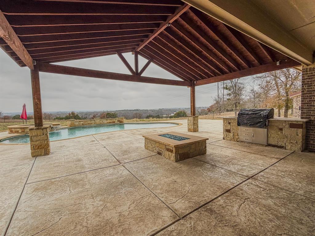 1600 Oak Ridge Estates Weatherford, TX 76085 - Photo 39 of 40 a view of a terrace with wooden floor