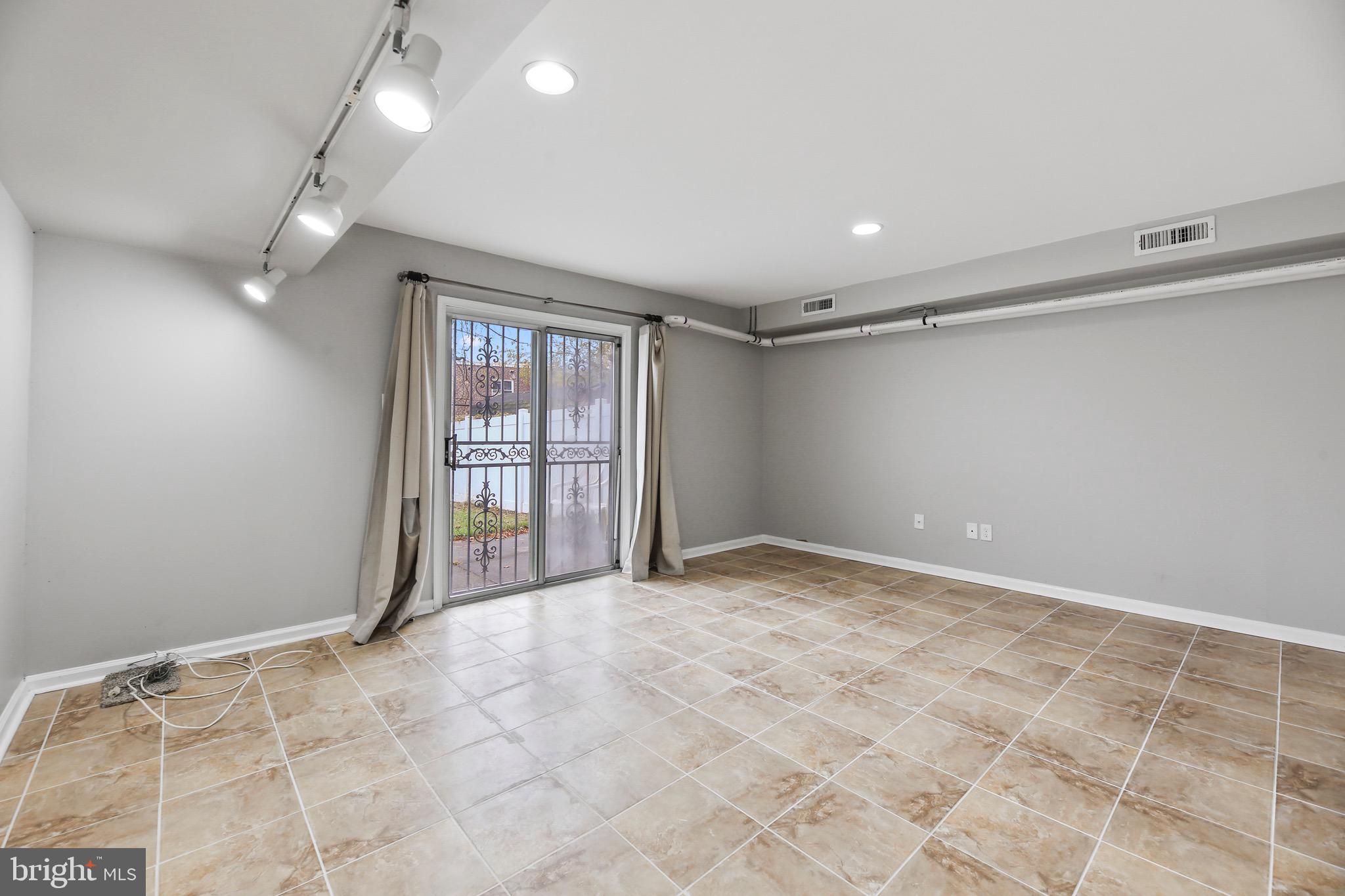 6218 Lindbergh Blvd. Philadelphia, PA 19142 - Photo 15 of 17 a view of an empty room with a window