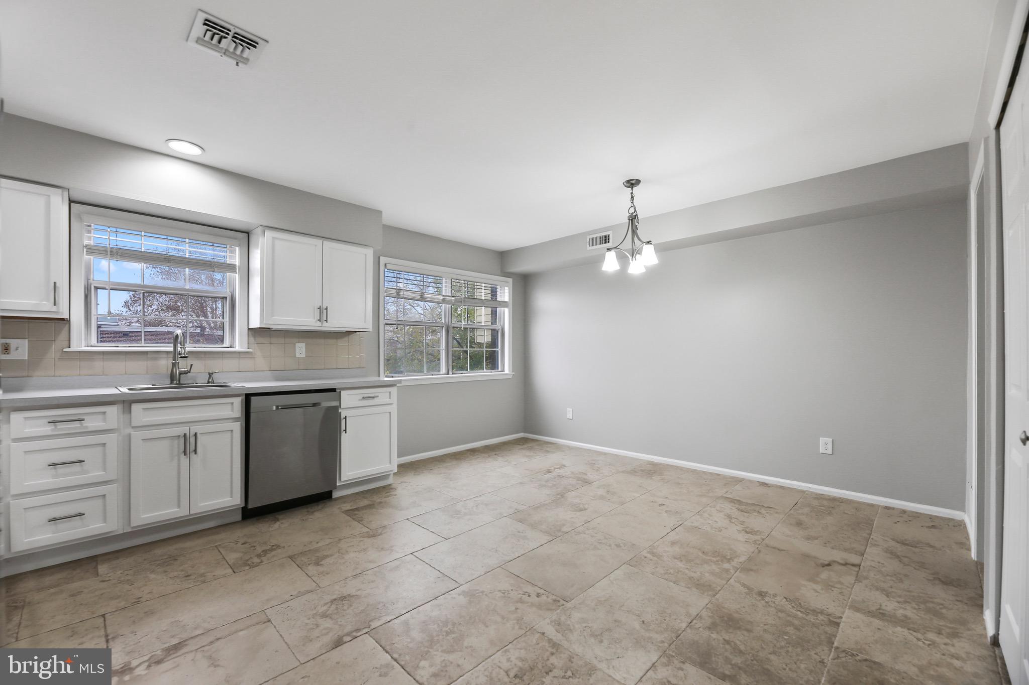6218 Lindbergh Blvd. Philadelphia, PA 19142 - Photo 5 of 17 a large kitchen with cabinets